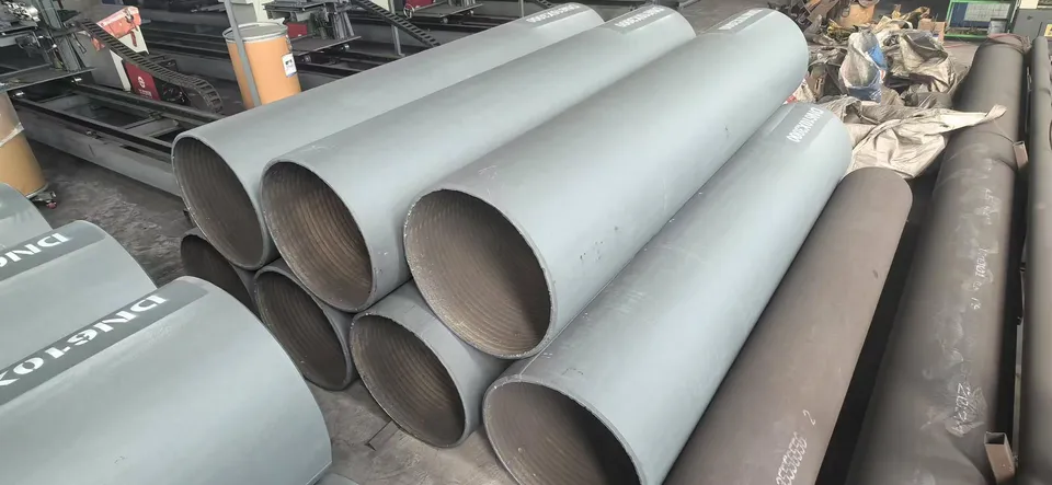 Weld overlay pipes with a ribbed overlay layer visible inside the open ends